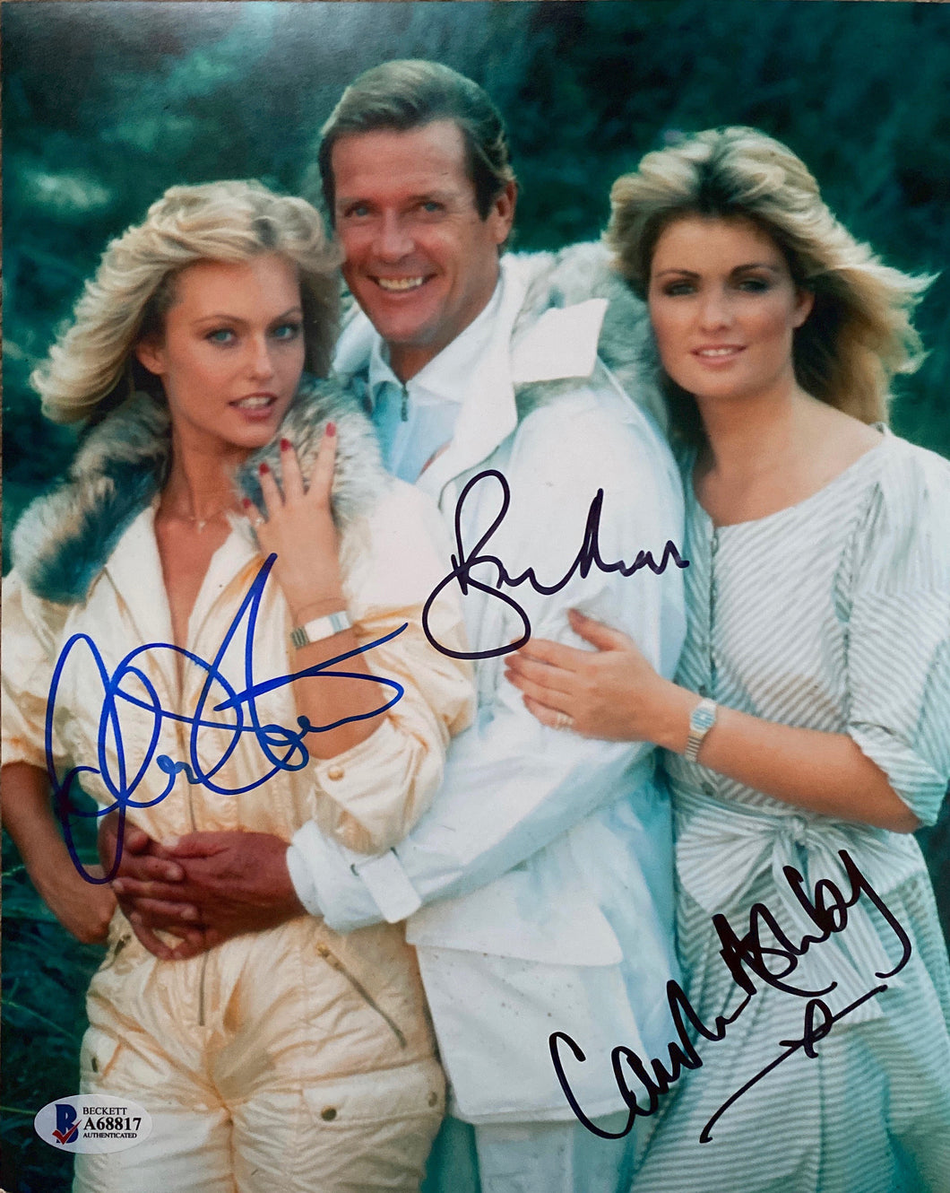 Roger Moore, Carole Ashby and Mary Stavin